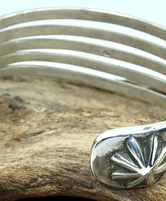 Five Bar Sterling Cuff with Fluted Repousse Button Terminals, Jewelry by John Begay