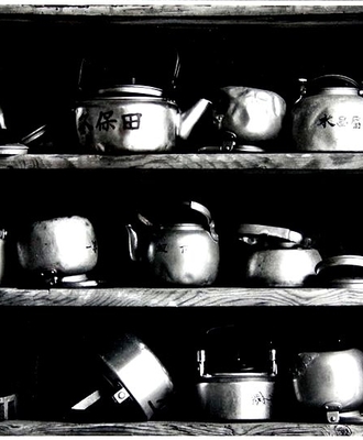 Metal Teapots on Shelves, Some Battered from Use, Photography by Errol  Zimmerman