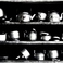 Metal Teapots on Shelves, Some Battered from Use, Photography by Errol  Zimmerman