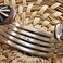 Five Bar Sterling Cuff with Fluted Repousse Button Terminals, Jewelry by John Begay