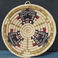 Coiled Basketry Plaque Featuring Left Hand Kachina Heads, Baskets by Irene Lomayaktewa